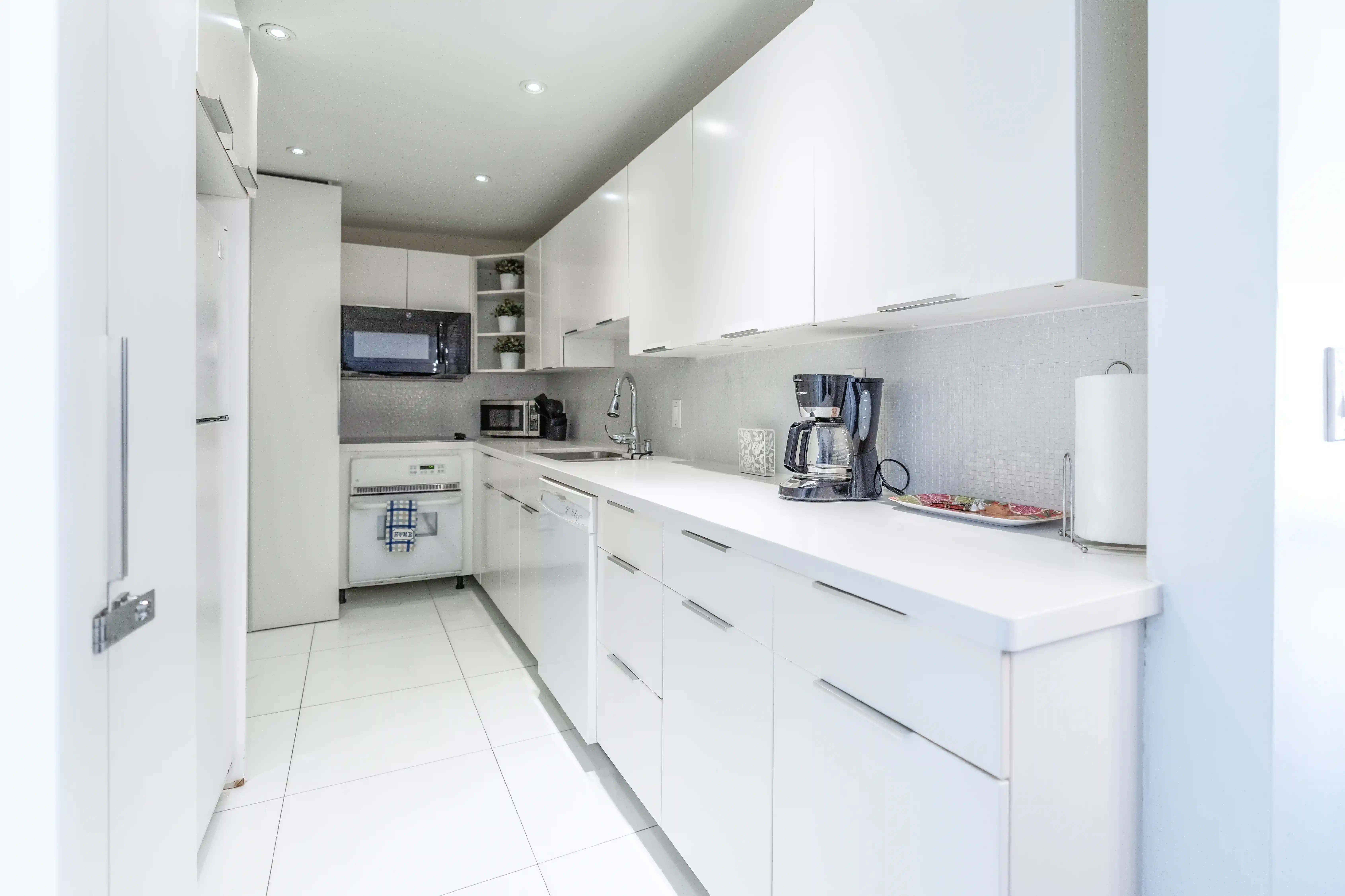 Fully equipped modern white kitchen